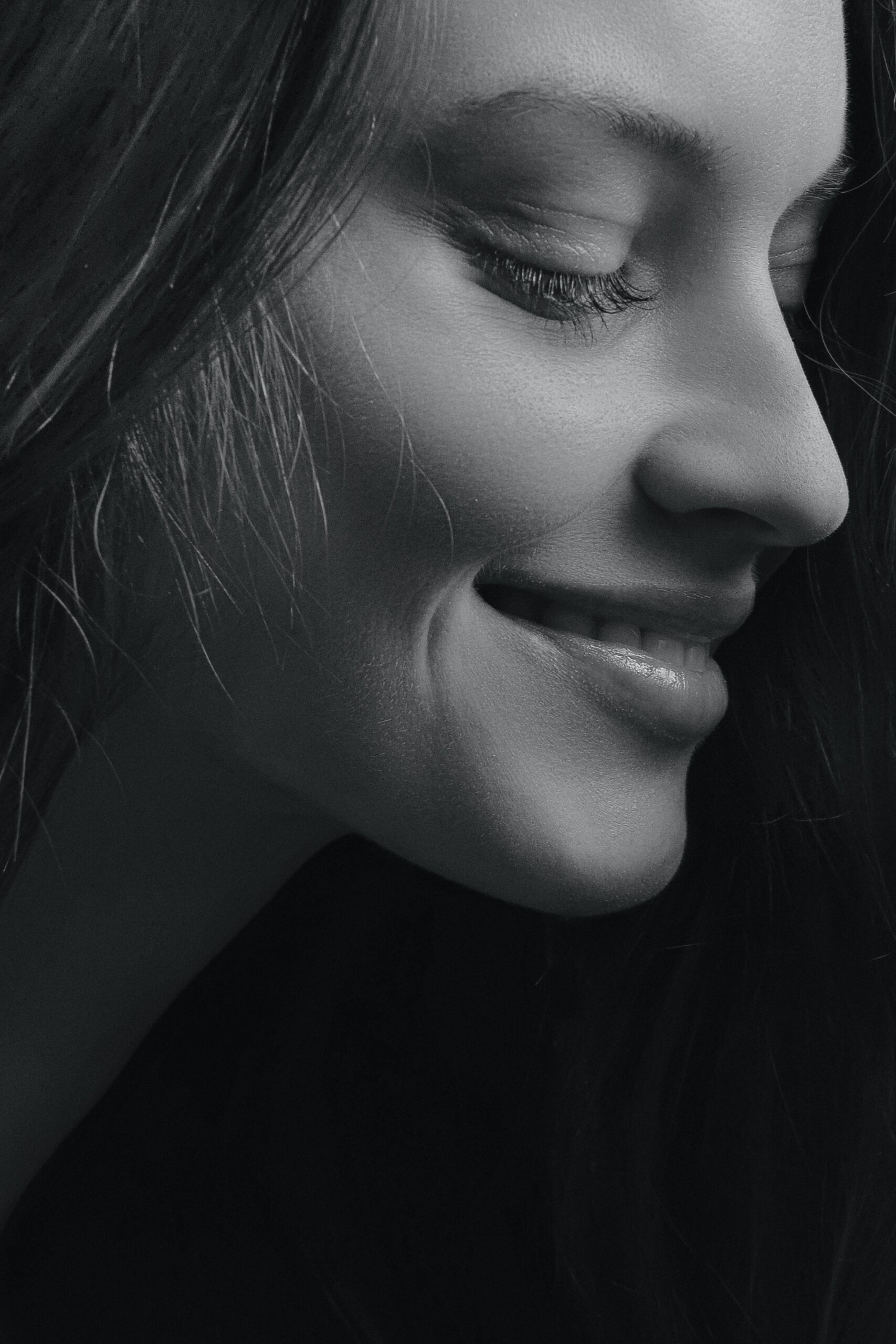 a young beautiful showing us her face after finishing dermal fillers