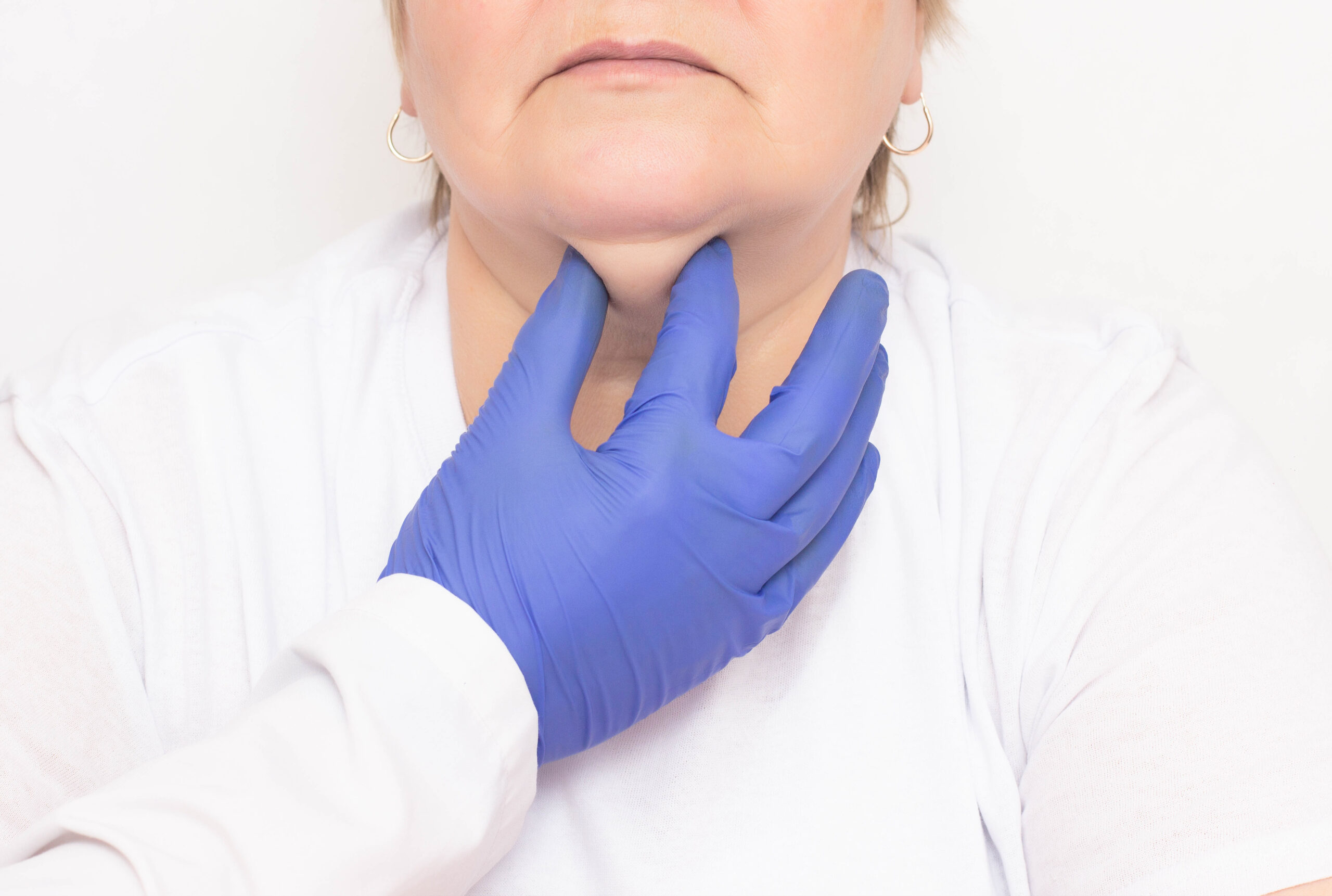 A woman ready to receive a fat dissolving injection on her neck for contouring and slimming