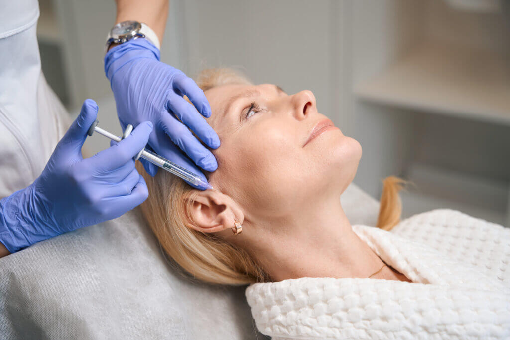 a lady doing anti wrinkles injectables in J Medical Aethetics which is a cosmetic clinic in Toorak, Melbourne