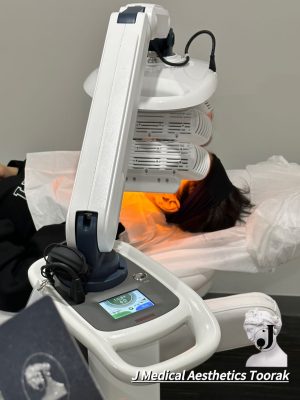 A lady receiving Healite II LED therapy treatment, known for its rejuvenating effects on the skin.