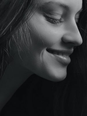 dermal fillers banner a young beautiful showing us her face after finishing dermal fillers
